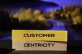 Customer Centricity on the sticky notes with bokeh background