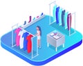 Customer choosing clothes in store. Shop assistant helps buyer to choose product during shopping