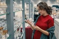 Customer choosing crystal glasses utensil dishes in the supermarket mall Royalty Free Stock Photo