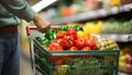 Customer choosing fresh vegetables in a supermarket aisle generated by AI Royalty Free Stock Photo