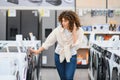 Customer choosing washing machine in electronics store Royalty Free Stock Photo