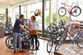 Customer and dealer in bicycle shop - purchase and repair of bicycles - customer service