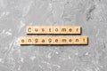 Customer engagement word written on wood block. Customer engagement text on cement table for your desing, concept Royalty Free Stock Photo