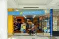 Customer entering Cancer Council retail shop. Cancer Council is a NFP organisation