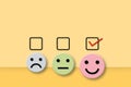 Customer evaluation or positive feedback concept rating. Check mark to select smile face circle on orange background.