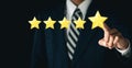 Customer experience concept. Businessmen touch Five-star give excellent ratings.