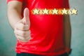 Customer experience concept. Happy Client show Thumb Up in meaning Great Royalty Free Stock Photo