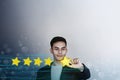 Customer Experience Concept. Young Businessman with Happy Face Showing his Five Star Services Rating Satisfaction. Happy Client`s Royalty Free Stock Photo