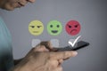 Customer Experience dissatisfied Concept, Unhappy Businessman Client with Sadness Emotion Face on smartphone screen, Bad review, Royalty Free Stock Photo