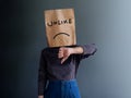 Customer Experience or Human Emotional Concept. Woman Covered her Face by Paper Bag and present Sadness Feeling and Disappointed