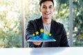 Customer Experiences Concept. Happy Young Man Sitting at the Desk and presenting his Five Star Rating in Online Survey Royalty Free Stock Photo