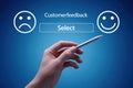 Customer Feedback Selection Interface with Hand Pointing to Happy Emoticon on Digital Screen Royalty Free Stock Photo