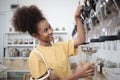 A customer fills cereal foods in a glass jar in a refill retail store