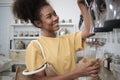 A customer fills cereal foods in a glass jar in a refill retail store