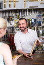 Ã¯Â»Â¿customer getting help at pay desk Royalty Free Stock Photo