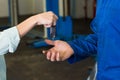 Customer giving her car keys to mechanic