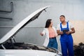 Customer hires a car service worker to repair a car