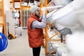 a customer in a home improvement store chooses a new toilet bowl Royalty Free Stock Photo