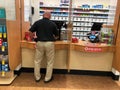 Customer inside a pharmacy shop. Royalty Free Stock Photo