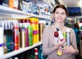 Customer looking for hair care products Royalty Free Stock Photo
