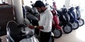 customer looking at latest version of motorcycles at bajaj bike showroom in India