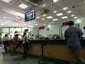 Customer making banking transactions at the counter