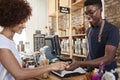 Customer Making Contactless Payment For Shopping At Checkout Of Grocery Store Using Mobile Phone