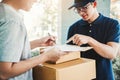 Customer Man signature in clipboard to receive package from professional delivery man at home