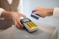 Customer Man Swiping Credit Card Paying Via Terminal Indoor, Closeup
