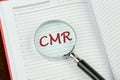 Customer Managed Relationship Concept. CMR word through a magnifying glass on a notepad page Royalty Free Stock Photo