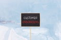 Customer onboarding symbol. Concept words Customer onboarding on beautiful yellow black blackboard. Beautiful blue ice background