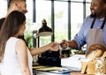 Customer paying for bakery products by credit card Royalty Free Stock Photo