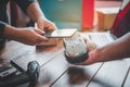 Customer paying bill through smartphone using NFC technology.Closeup of hand making payment through contactless machine Royalty Free Stock Photo