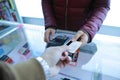 Customer paying card,Woman hand with credit card swipe through terminal for sale Royalty Free Stock Photo