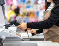 Customer Paying at Checkout Counter in Retail Store Royalty Free Stock Photo