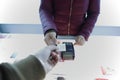 Customer paying card,Woman hand with credit card swipe through terminal for sale