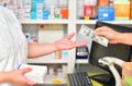 Customer paying for Medicaments in pharmacy