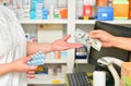 Customer paying for Medicaments in pharmacy