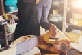 Customer paying for order of cheese in grocery shop. Royalty Free Stock Photo