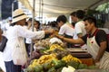 Customer paying for vegetables at street organic market