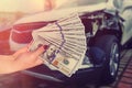 Customer pays money dollars for car repair