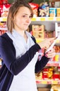 Customer pointing at shopping list Royalty Free Stock Photo