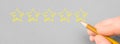 Customer rating with hand drawn stars. Customer review good rating concept hand drawing five star on grey paper and positive Royalty Free Stock Photo