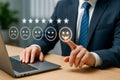 Customer satisfaction feedback concept with five star rating and happy face icon on digital interface Royalty Free Stock Photo