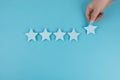 Customer satisfaction survey, Evaluating excellent services rating concepts. The client`s hand picked the five star symbol