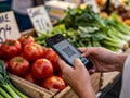 Customer Scanning QR Code on Smartphone at Fresh Produce Market for Digital Payment Royalty Free Stock Photo