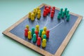 Customer segmentation concept. Colorful figurines and arrows on the board.