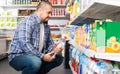 Customer selecting bottle of water