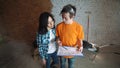 The customer sends the plan of the house to the Builder, explains how to redevelop the house. A man and a woman are
