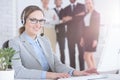 Customer service agent and her colleagues Royalty Free Stock Photo